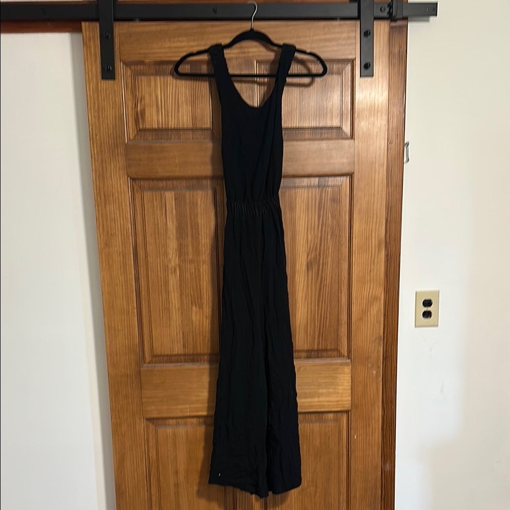 Hem and Thread Black Jumpsuit with Open-back Criss-cross Design